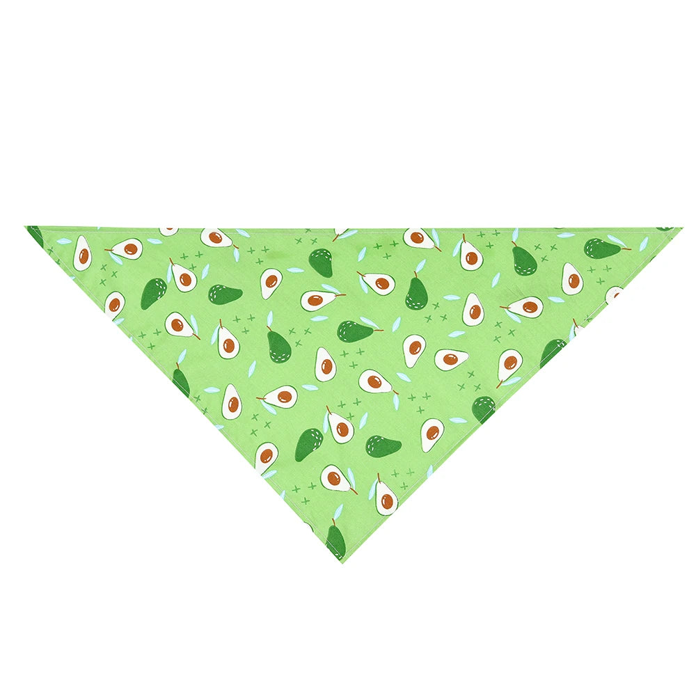 Green dog bandana with cute avocado print and playful patterns on a white background.