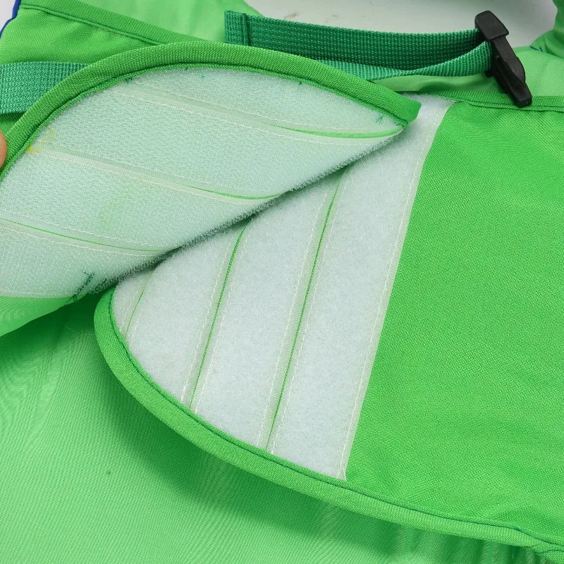 Green dog life jacket with breathable mesh, reinforced buoyancy panels, and reflective strap for safe swimming