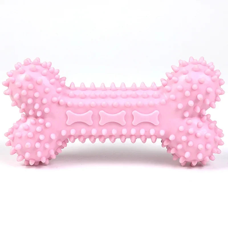 Pink spiked rubber dog chew toy in bone shape on white background