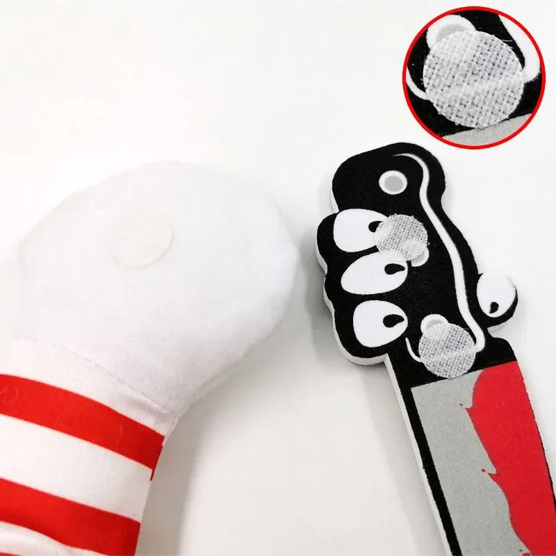 Dog toy with red and white striped sleeve and detachable cartoon knife with Velcro