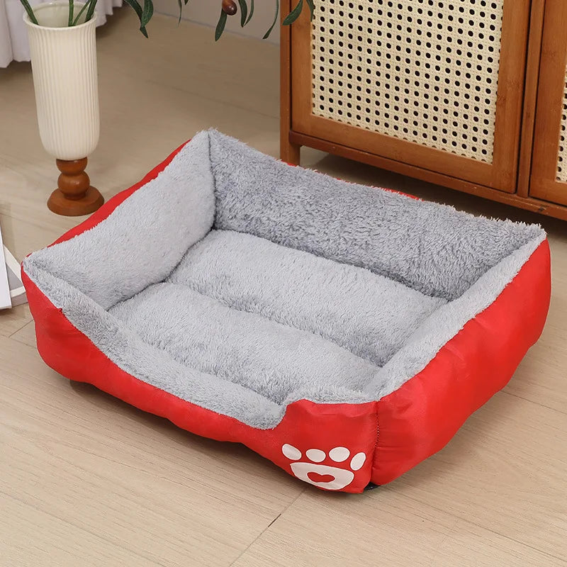 calming plush dog bed with soft gray cushion and red sides for small dogs, puppies, and cats