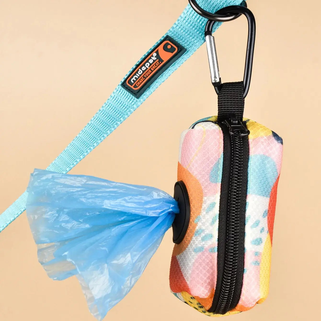 dog poop bag holder dispenser with colorful abstract print, zipper closure, and leash clip for easy walk cleanup