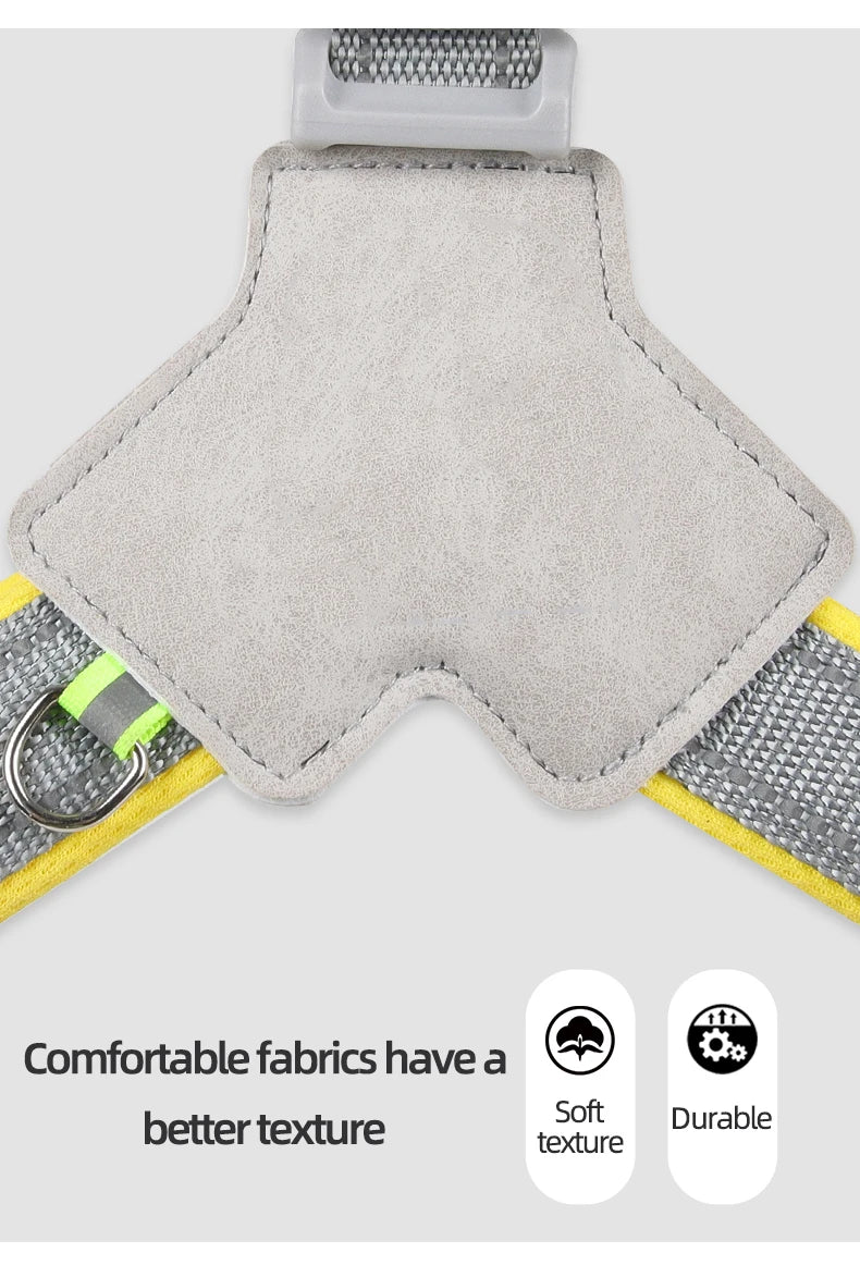 Close-up of a soft, durable dog harness with grey fabric, yellow trim, and sturdy stitching.