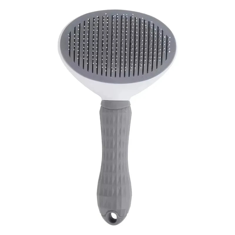 Gray dog grooming brush with ergonomic handle and fine bristles on white background
