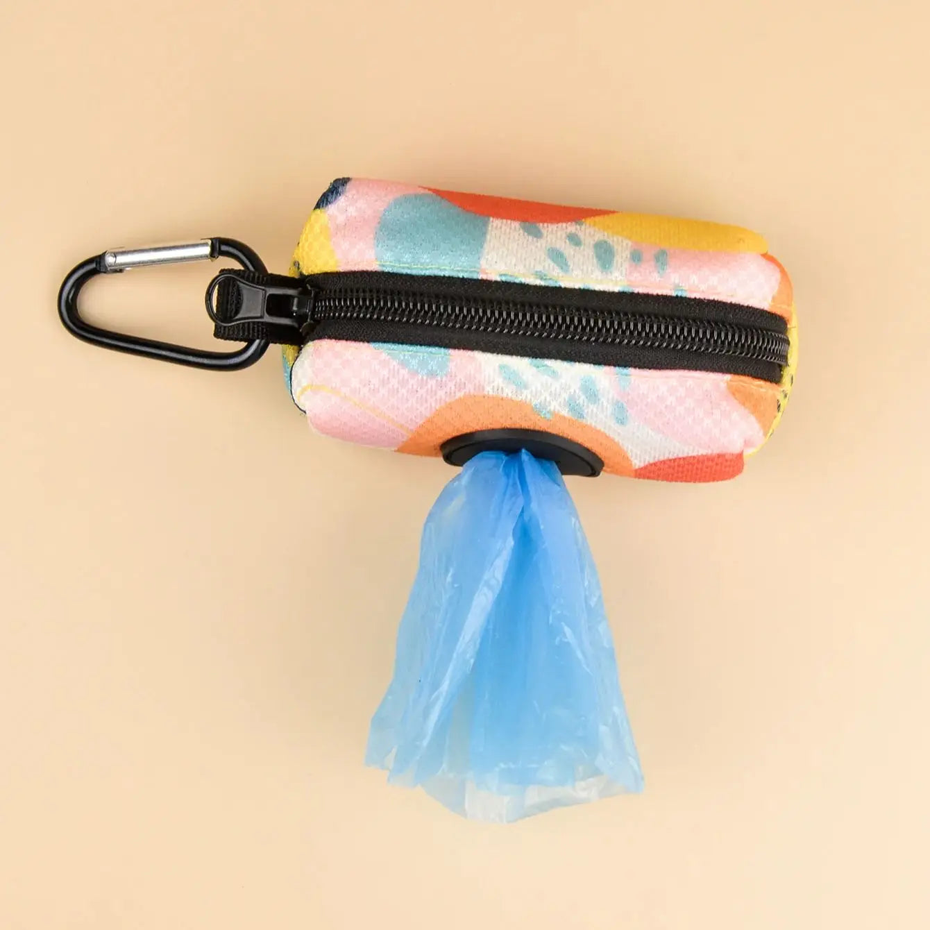 Colorful abstract dog poop bag holder dispenser with carabiner clip and attached poop bag