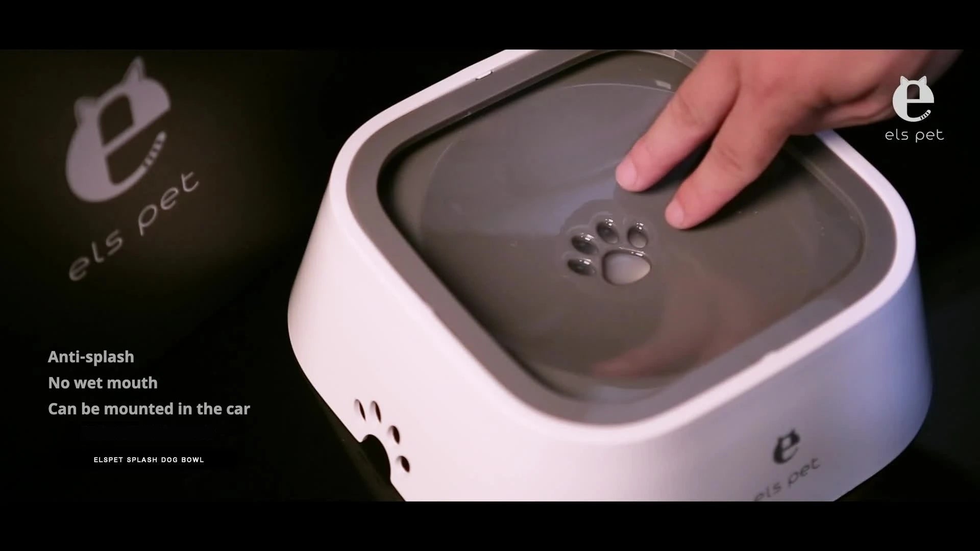 Hand demonstrating anti-splash dog water bowl with paw print design and spill-resistant lid.
