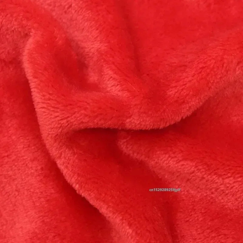 Close-up of soft red fleece fabric, ideal for cozy dog bedding or pet blankets.