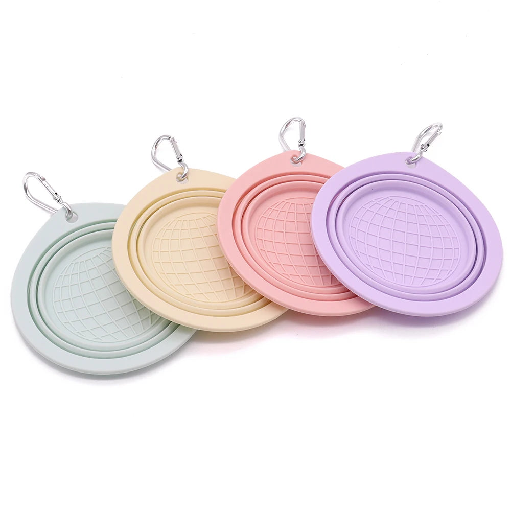Collapsible pet food water bowl in macaron colors with carabiner for outdoor travel and portable use.