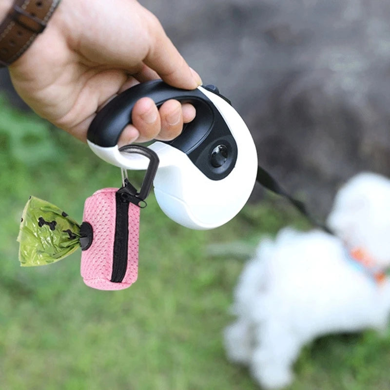 Dog poop bag holder dispenser attached to leash for easy pet waste cleanup and convenient walks