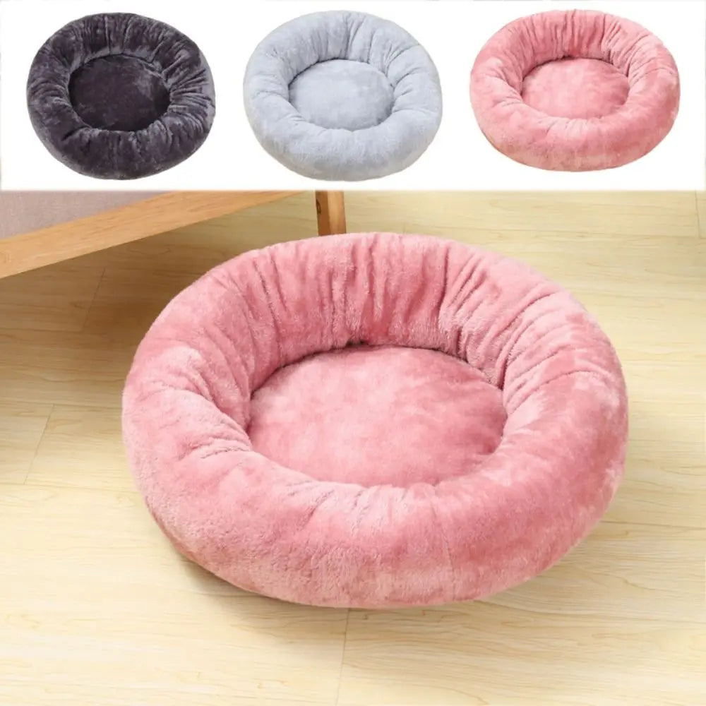 Plush pink donut dog bed for small dogs and cats, soft washable round pet cushion for cozy indoor comfort