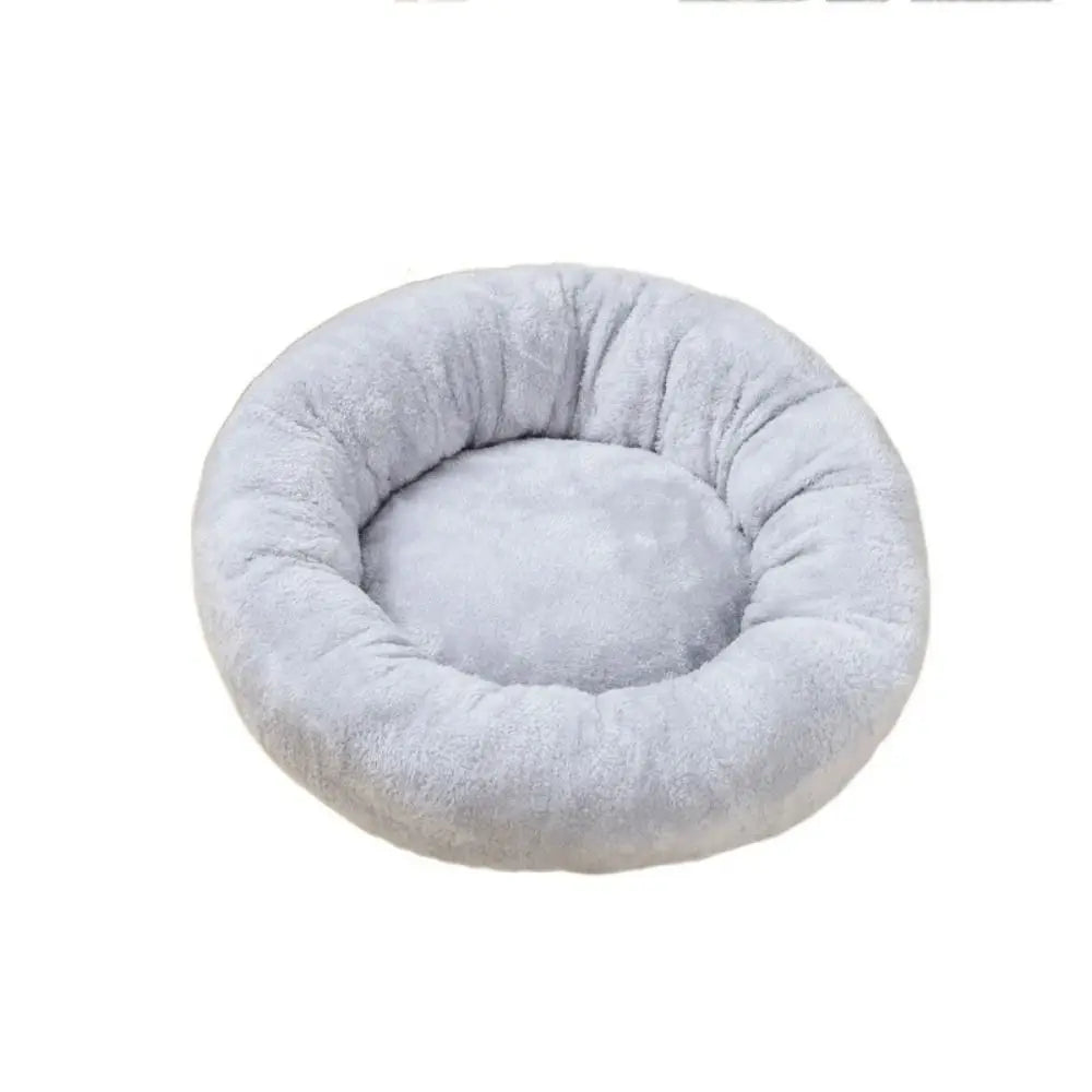 Light grey donut dog bed, soft washable round plush pet cushion for dogs and cats, warm waterproof puppy and kitten bed