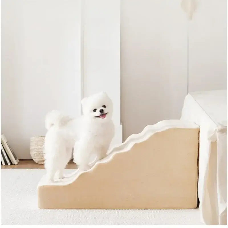 anti-slip dog stairs for small dogs with a fluffy dog standing on the steps near a bed.