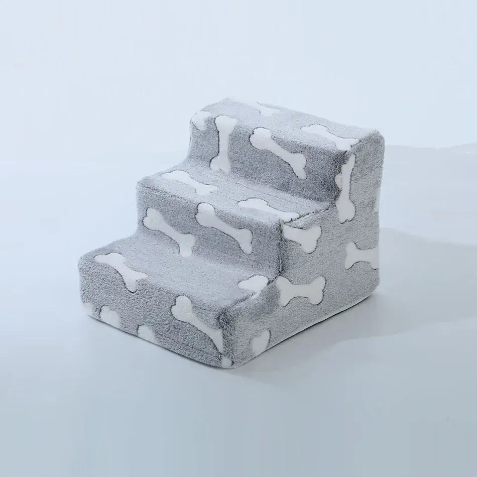 Dog safety ramp for medium dogs with a cozy grey design featuring bone shapes for easy access to furniture.