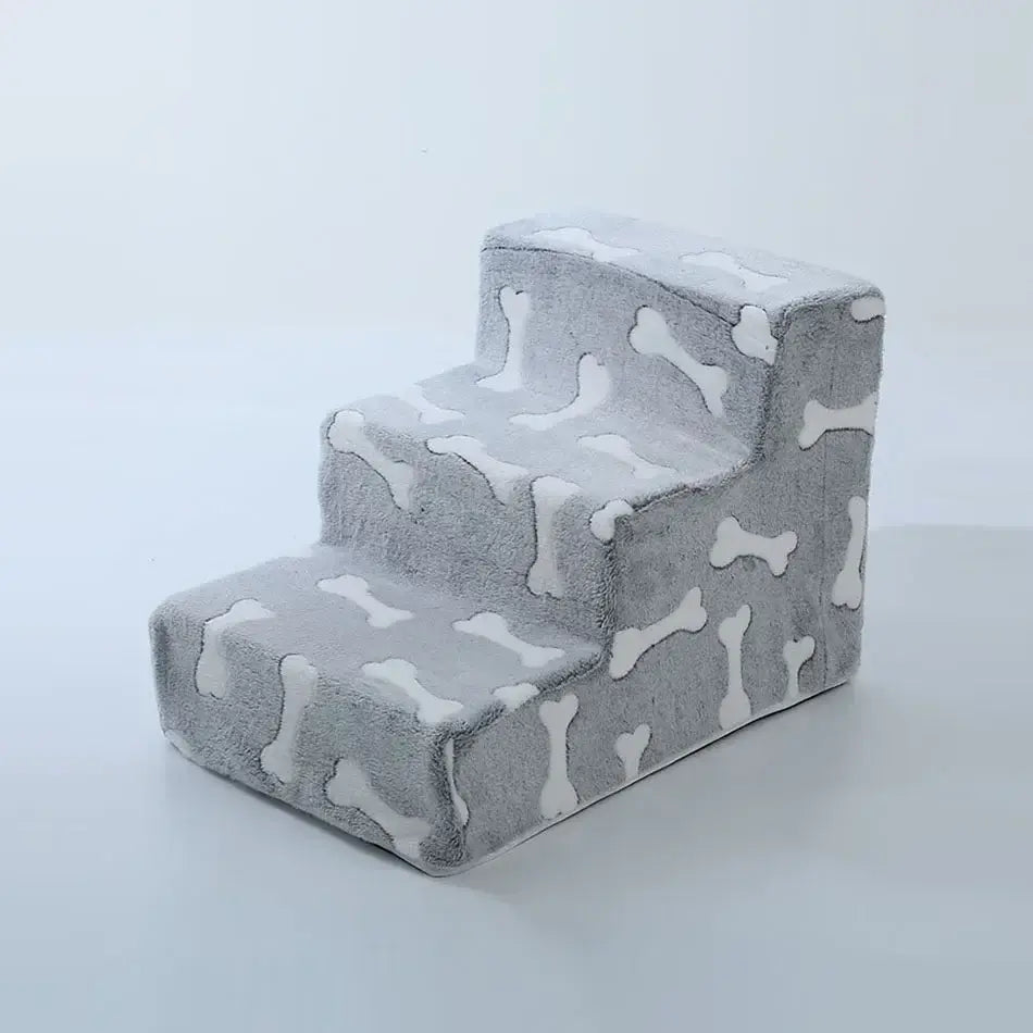 Dog safety ramp for medium dogs with a gray bone-patterned design, perfect for elderly pets to access sofas.