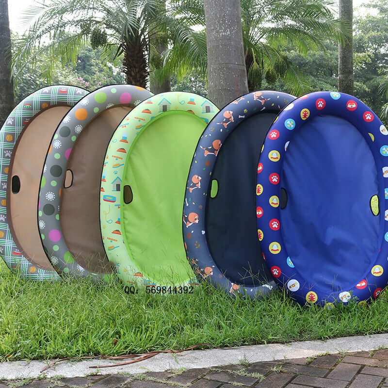 Five colorful inflatable dog swimming pool floats displayed in a grassy area, ideal for pets to enjoy summer fun.