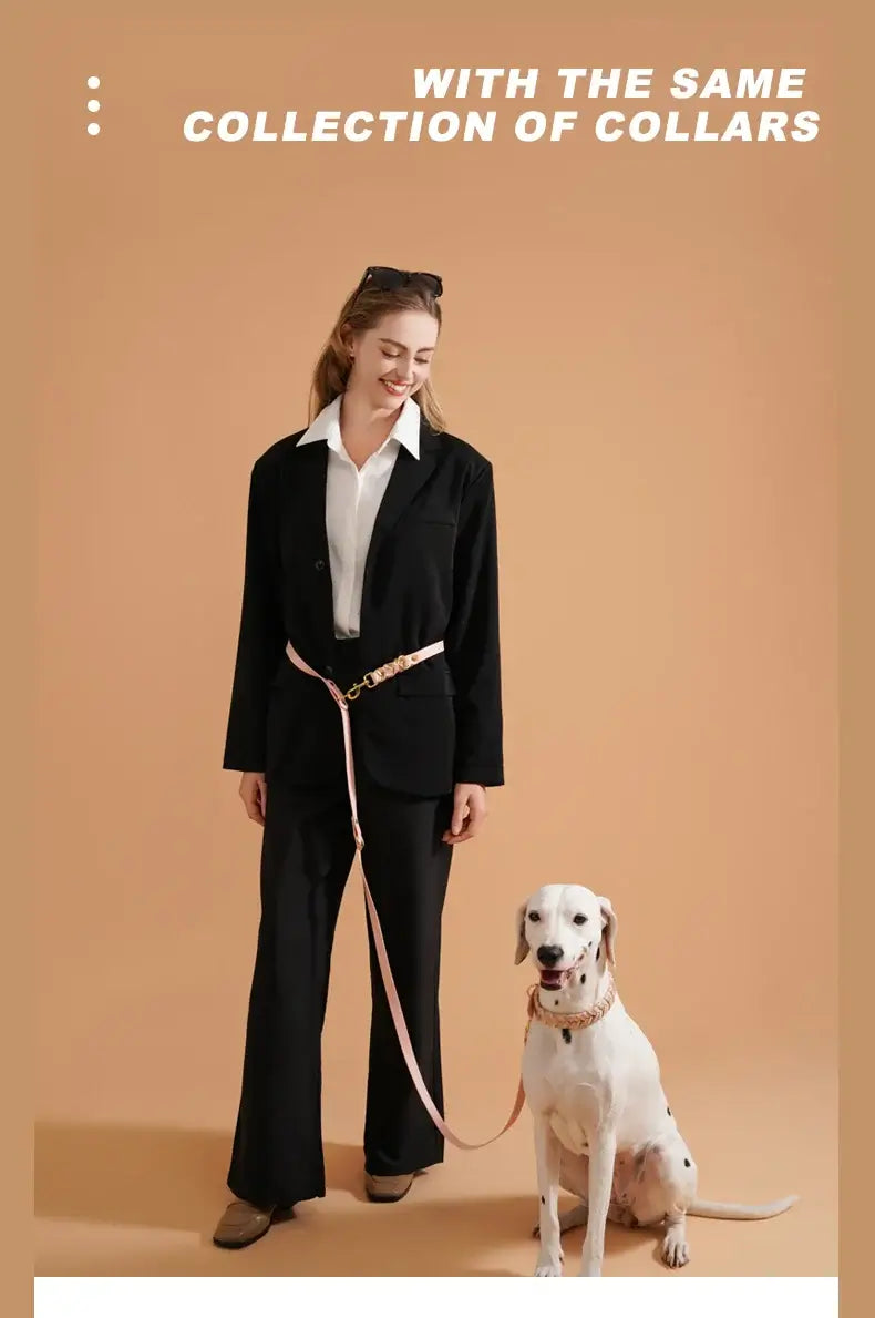With the same collection of collars, a woman walks her dog using a stylish leash.
