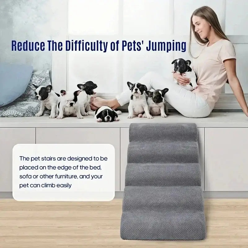 memory foam dog stairs for small pets placed beside a bed with a woman and multiple small dogs.