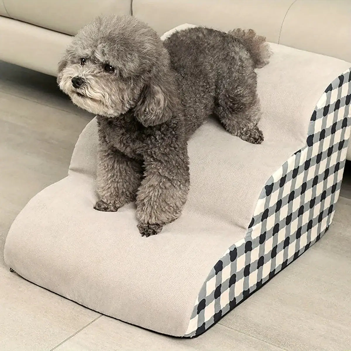 Small dog using 1pc pet stairs for small dogs to get on a sofa, featuring non-slip steps for safety.