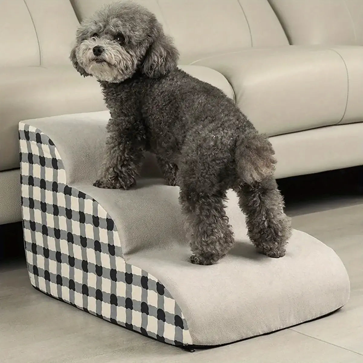 Small dog using pet stairs for small dogs, 2/3 step foam ramp designed for small senior dogs and safety.