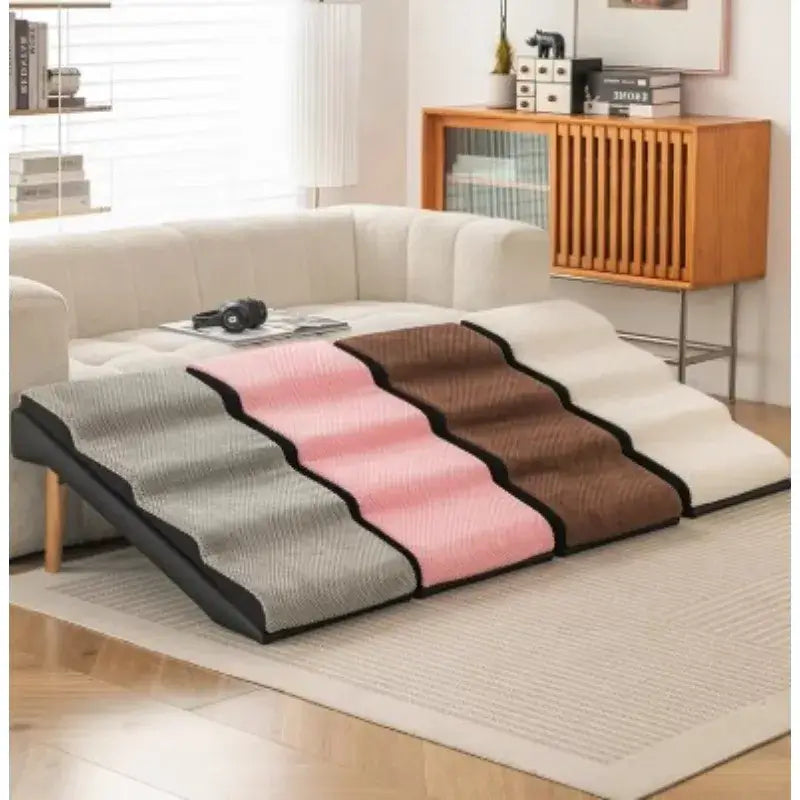Removable and washable pet stairs for dogs and cats placed beside a sofa in a modern living room setting.