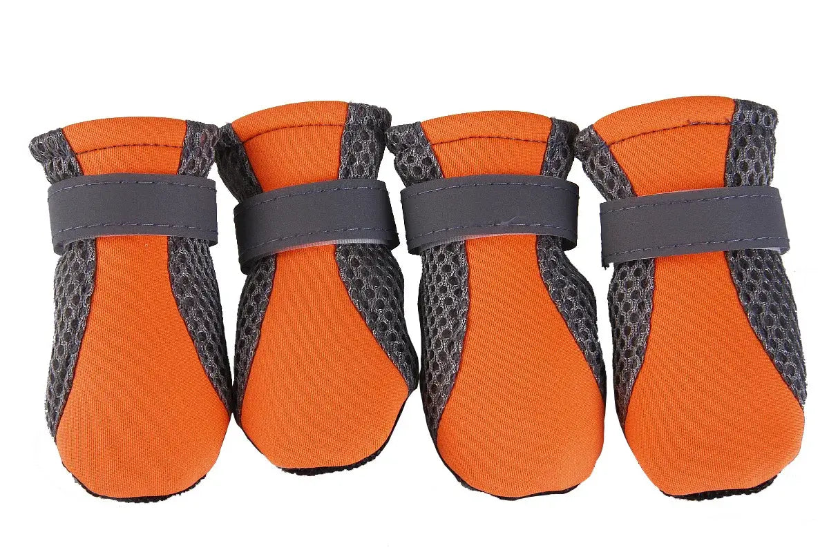 Orange waterproof dog boots with anti-slip rubber soles and adjustable straps for small to large pets