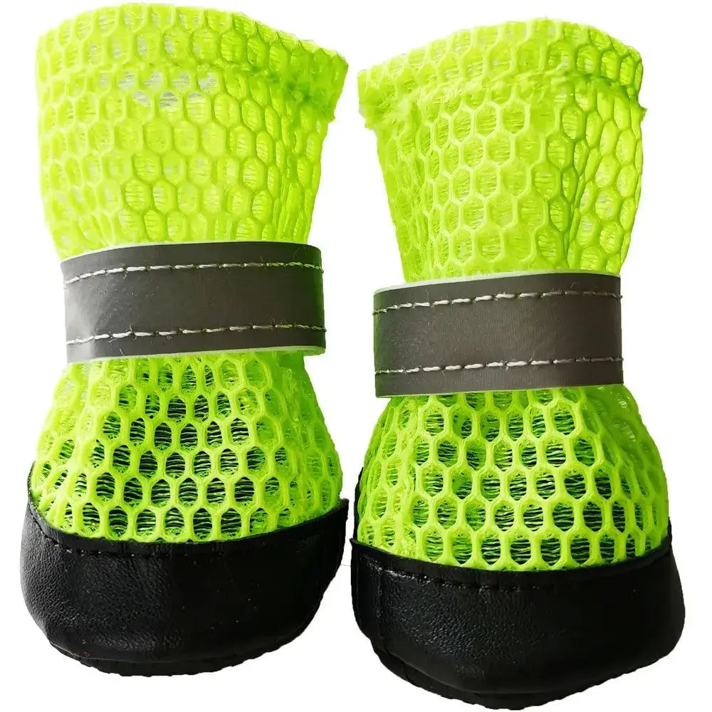 4pcs winter dog boots for small dogs in bright green mesh with reflective straps and black soles.