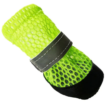 Winter dog boots for small dogs in bright green color with reflective strap and antiskid sole for better grip.