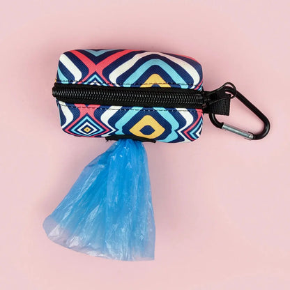 cute dog poop bag holder with geometric print, zipper closure, carabiner clip, and blue waste bag on pink background