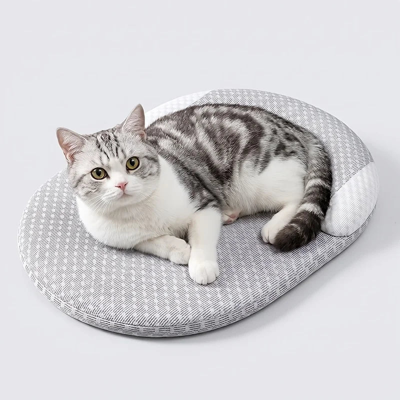 Cooling cat bed with breathable round design and neck support for cats, water-washable summer pet mat for hot weather.