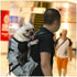 Hiking Pet Dog Carrier Backpack - Breathable Outdoor Travel Bag with a dog in a backpack being carried by a person.