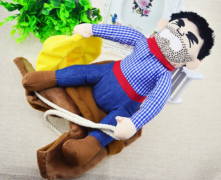 Funny cowboy-themed plush dog toy with rope and fabric hat on beige surface