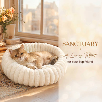 Plush donut cat bed with ultra soft cream bolster for cozy deep sleep and anxiety relief for cats and small pets