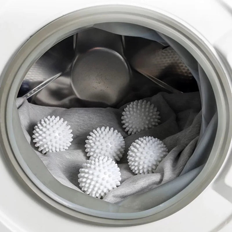 laundry anti-winding balls in washing machine with clothes, reusable anti-tangle laundry cleaning essentials