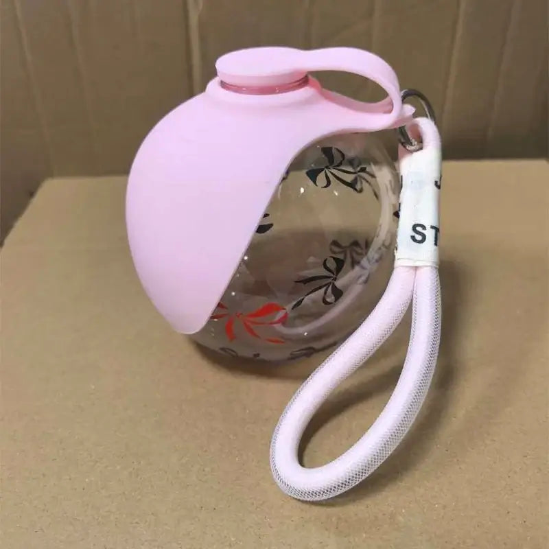 portable dog water bottle pink leak-proof spherical pet drinking fountain with lanyard for travel