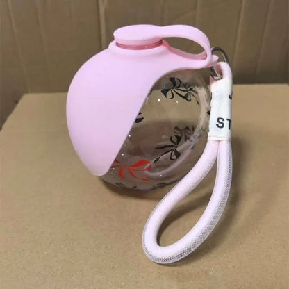 portable dog water bottle pink leak-proof spherical pet drinking fountain with lanyard for travel