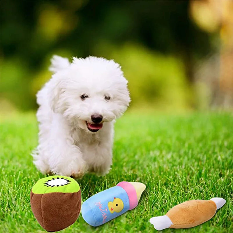 White puppy playing on grass with plush squeaky dog chew toy for small dogs and cats