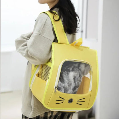 Woman wearing a yellow breathable pet carrier backpack for cats and small dogs, portable outdoor transport bag