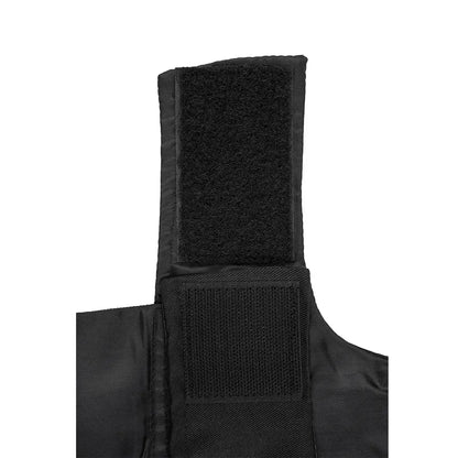 Close-up of a black velcro attachment on pet clothing fabric for securing fits.