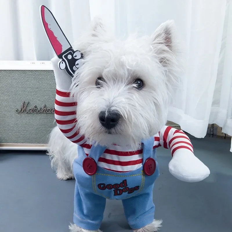 White dog in striped shirt and blue overalls costume holding fake knife, novelty pet apparel