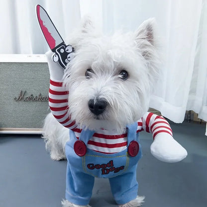 White dog in striped shirt and blue overalls costume holding fake knife, novelty pet apparel