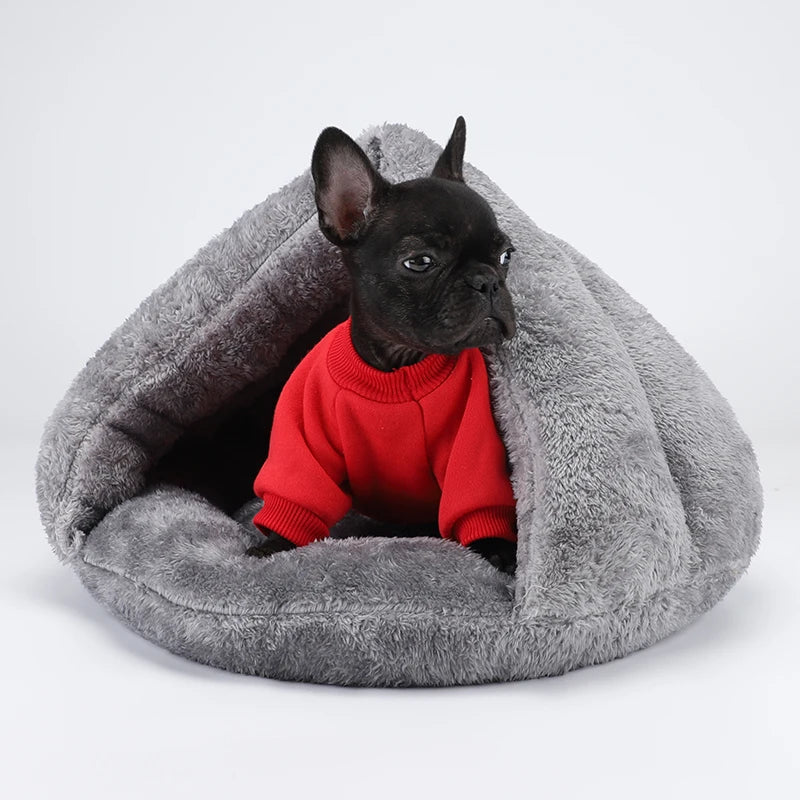Black puppy in red sweater resting in a washable plush dog bed gray cave-style pet bed for small dogs