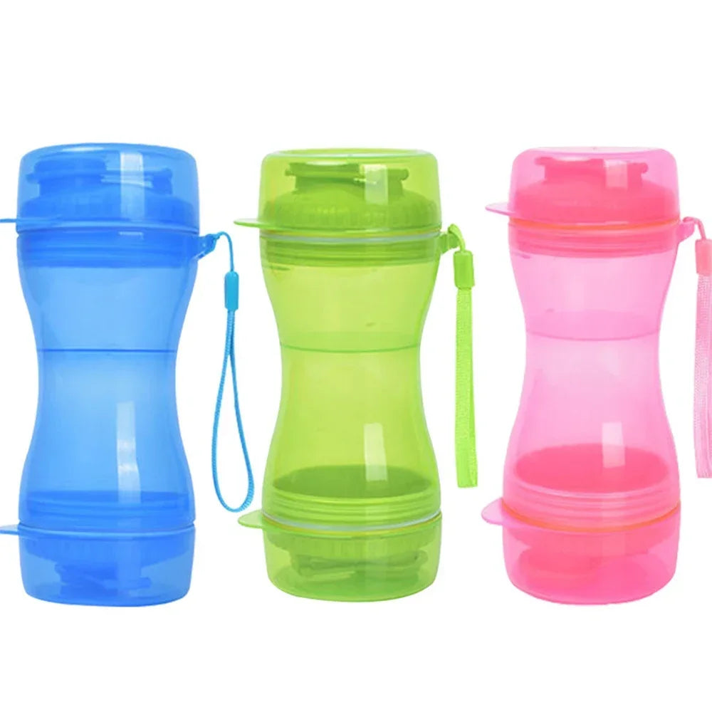 Three portable dog water bottles in blue, green, and pink, with wrist straps, on white background.