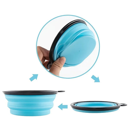Portable collapsible pet food bowl shown in blue, demonstrating its folding capability for easy travel.
