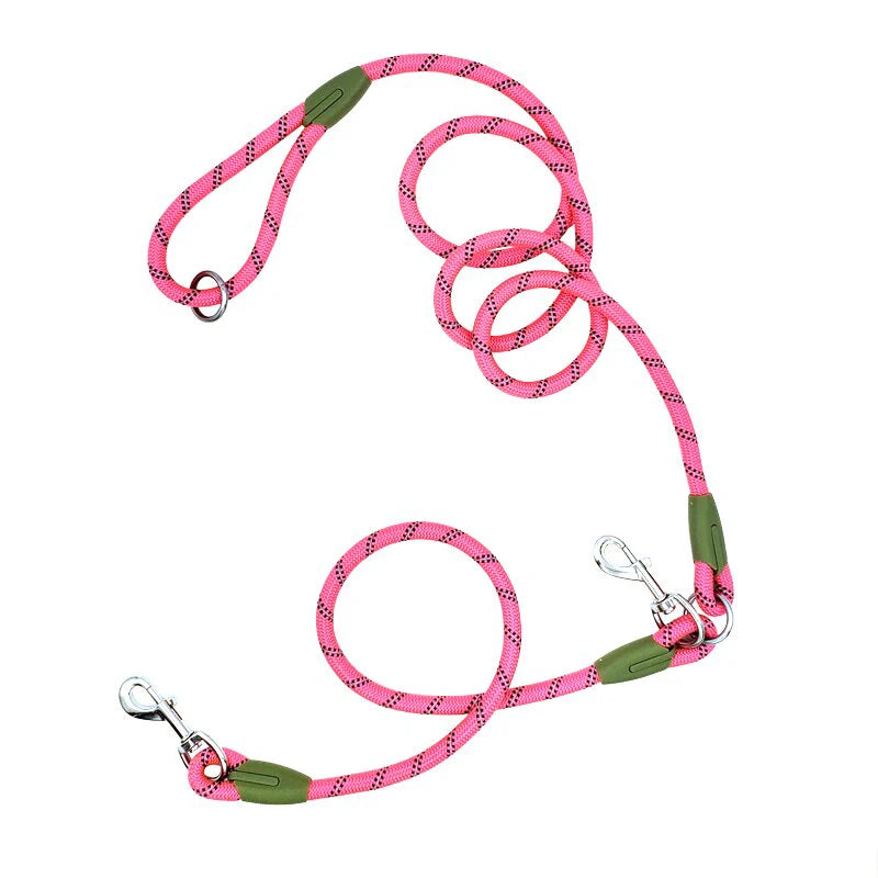 Pink double dog leash with reflective rope, metal clips, and green accents on white background
