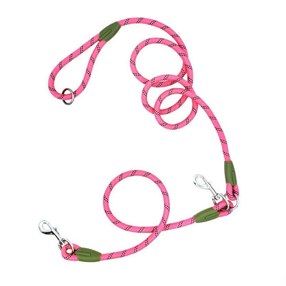 Pink double dog leash with reflective rope, metal clips, and green accents on white background