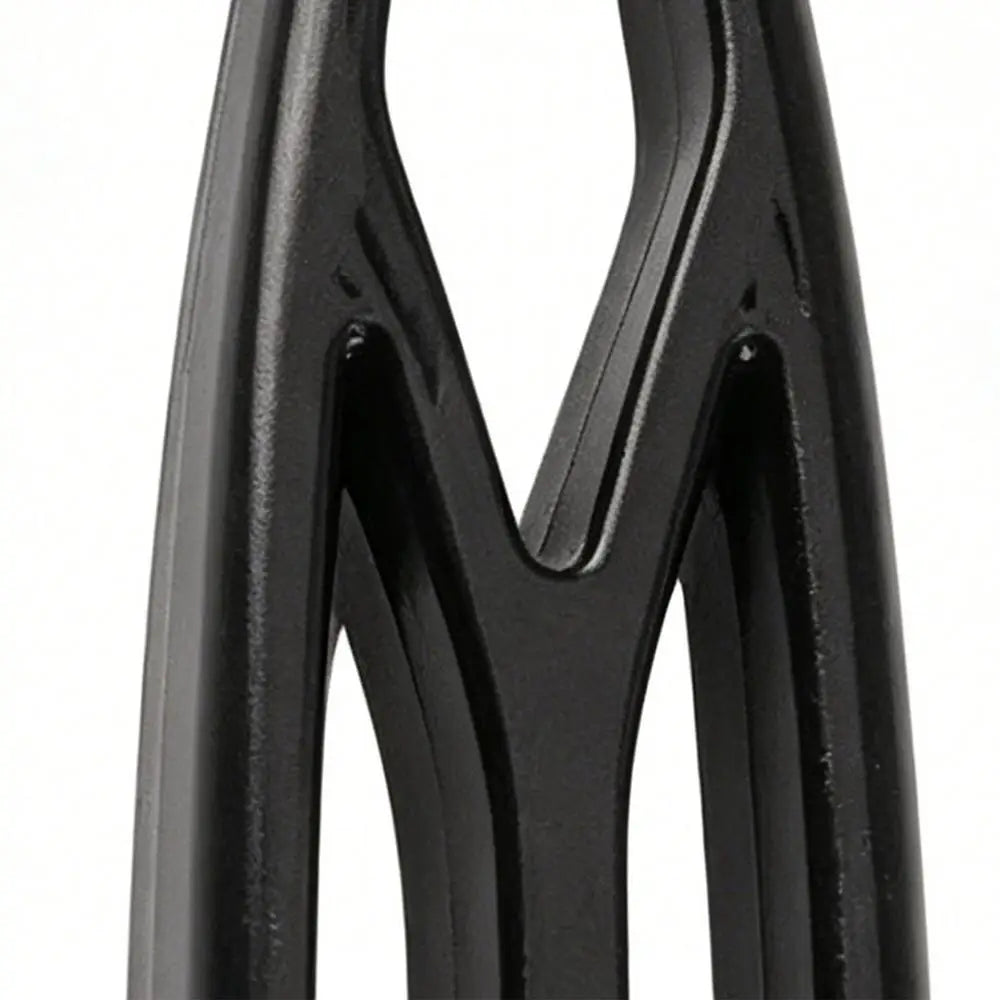 Black pet deshedding brush close-up, stainless steel grooming tool for removing loose fur and tangles from dogs and cats