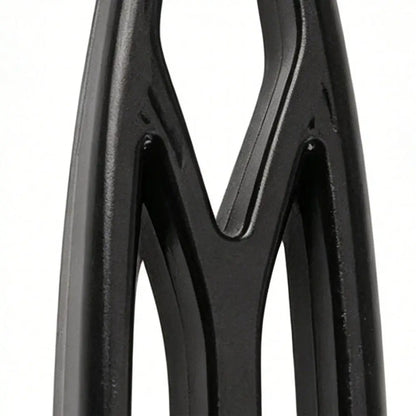 Black pet deshedding brush close-up, stainless steel grooming tool for removing loose fur and tangles from dogs and cats