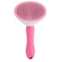 Pink dog grooming brush with ergonomic handle and fine bristles for pet hair care