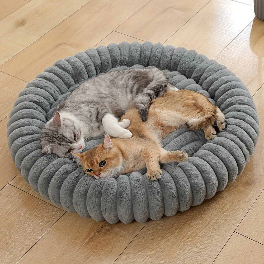 plush donut cat bed with three cats resting in a soft gray round pet nest on a wooden floor