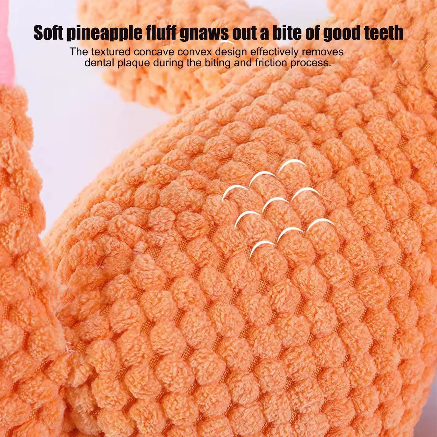 Close-up of orange textured plush dog toy with concave convex design for dental cleaning.